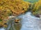 Voidomatis river in aristi village trees rafting boats in autumn season