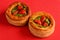 Vol-au-vent with mushroom and chicken, on a red paper