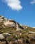 Volax village in Tinos island, Cyclades Greece. Huge granite volcanic rock. Summer day, blue sky