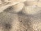 Volcanic beach sand, darker color, almost black. Picture taken on a beach in Lanzarote, Canary Islands, Spain