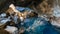 Volcanic cave Grjotagja with a incredibly blue and hot thermal water near lake Myvatn, Iceland