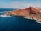 Volcanic crater with blue ocean near La Santa in Lanzarote. Aerial view