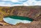 Volcanic crater Kerid with blue lake inside, Iceland tourist attraction