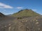 Volcanic desert landscape with green Hattafell mountain with footpatj of Laugavegur trail. Fjallabak Nature Reserve