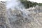 Volcanic fumaroles in the geothermal field. Jets of steam come out of the earth. Monterotondo, Larderello, Tuscany