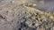 Volcanic gas exiting through fumaroles on Fossa crater of Vulcano island. Steaming surface. Lipari Islands. Sicily