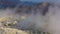 Volcanic gas exiting through fumaroles on Fossa crater of Vulcano island. View on Lipari Islands. Mediterranean sea