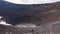 Volcanic gas exiting through fumaroles on Grand or Fossa crater of Vulcano island. Lipari Islands. Blue sky. Sicily