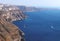 Volcanic high cliffs reaching into the ocean, Fira, Santorini, Greece