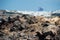 Volcanic island Nea Kameni, Santorini in background, Greece