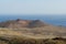 Volcanic landscape and Orchilla lighthouse, El Hierro island.