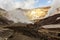 Volcanic landscape. Steaming, sulfuric, active fumaroles near Volcano Mutnovsky, Kamchatka, Russia