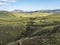 Volcanic landscape witch colorful rhyolit mountain, green hills and small stream with lush moss. Fjallabak Nature