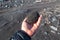 Volcanic pumice in hand, Kamchatka Peninsula, Russia.