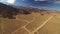 Volcanic Rock Formation Fly Over Aerial Shot of Volcano in Eastern Sierra California USA Forward Tilt Up