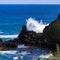 Volcanic rock, surf, and blue water on the Maui coaset