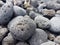 Volcanic rocks rounded by the aleaje of the sea on a beach in Lanzarote, Spain