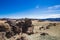 Volcanic rocks of the volcano. desert with stones mountains and blue sky