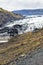 volcanic slope and view of Solheimajokull glacier