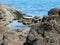 Volcanic strata on the Atlantic Ocean in Seixal in Madeira.