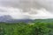 Volcano Agung or Gunung Agung on a rainy day. Low clouds over a sacred volcano and jungle. Lava traces on the slopes of the mount.