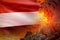 Volcano blast eruption at night with explosion on Yemen flag background, problems of natural disaster and volcanic earthquake