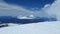 Volcano clouds snow blue white up top space view high winter ice flight