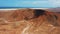 Volcano crater. Trip to Fuerteventura. Aerial view of desert landscape, mountains, sands and vast arid terrain. Barren