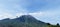 a volcano emitting white smoke