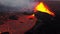 Volcano erupts in Iceland, red hot lava bursts out of the ground. Crater of an active volcano. Catastrophe, natural