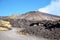 Volcano Etna, Sicily, Italy. Slopes with road and cableway. Crater of Etna. Smoking peak of active volcano Etna