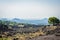 Volcano Etna view with old house and lava stones around