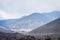 Volcano Etna view with tourists and lava stones all around in the mist