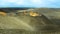 Volcano landscape with colorful crater