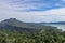 Volcano landscape with lava fields, pine tree forest and farms and houses on the slopes. Kintamani is a village on the western