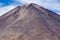 Volcano Licancabur andf cloudy blue sky