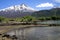 Volcano Llaima at Conguillio NP in central Chile - View over the lake on black peak with  spots of snow