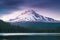 The volcano mountain Mt. Hood, in Oregon, USA. At sunset with reflection on the water of the Trillium lake. Beautiful West Coast.