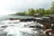 Volcano rocks with ocean and palm trees during the storm on Hawaii