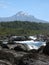 Volcano with volcanic rock and stream