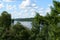 Volga river. On the banks of the river villages and forests. Sky clouds. Steep and precipitous banks, covered with trees that look