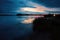 The Volga River in the first minutes of the morning sunrise. The bank, overgrown with reeds, can be seen in the background of