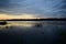 Volga river. Sunset. On the banks of the river villages and forests. Sky clouds. Steep and precipitous banks, covered with trees