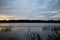 Volga river. Sunset. On the banks of the river villages and forests. Sky clouds. Steep and precipitous banks, covered with trees