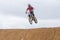 Volgograd, Russia - April 19, 2015: Motorcycle racer jumps a hill, at the stage of the Open Championship Motorcycle Cross Country