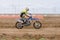 Volgograd, Russia - April 19, 2015: Motorcycle racer racing on dirt track, at the stage of the Open Championship Motorcycle Cross
