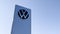 Volkswagen new modern logo front of car shop sign with vw store dealership