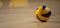 Volleyball ball on blurred wooden parquet background. Banner, space for text, close up view with details.