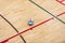 Volleyball ball on hardwood volleyball court