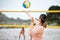 Volleyball, beach or serve of sports women playing a game in training or workout in summer together. Team fitness